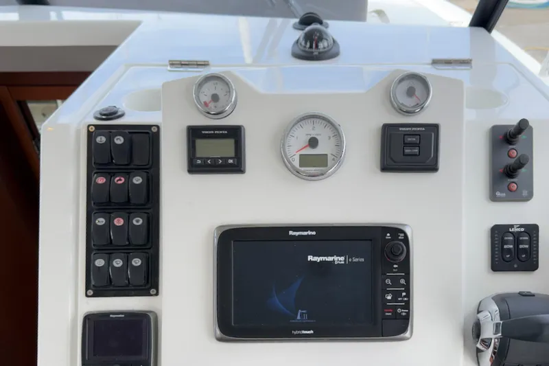 Slide: The Image of Control panel of a 2016 Beneteau Swift Trawler 30 with navigation instruments. - 31