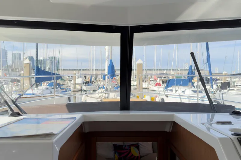 Slide: The Image of Interior view from 2016 Beneteau Swift Trawler 30, overlooking marina with sailboats. - 35