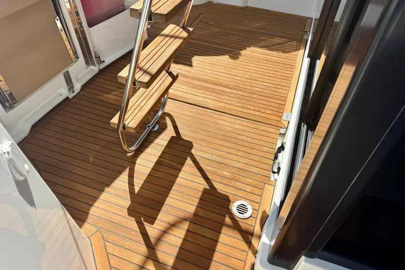 Slide: The Image of Teak deck and stairs on 2016 Beneteau Swift Trawler 30 boat. - 36