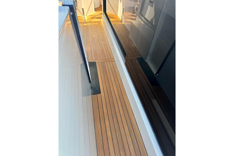 Slide: The Image of 2016 Beneteau Swift Trawler 30 teak deck with sleek design and modern finish. - 39