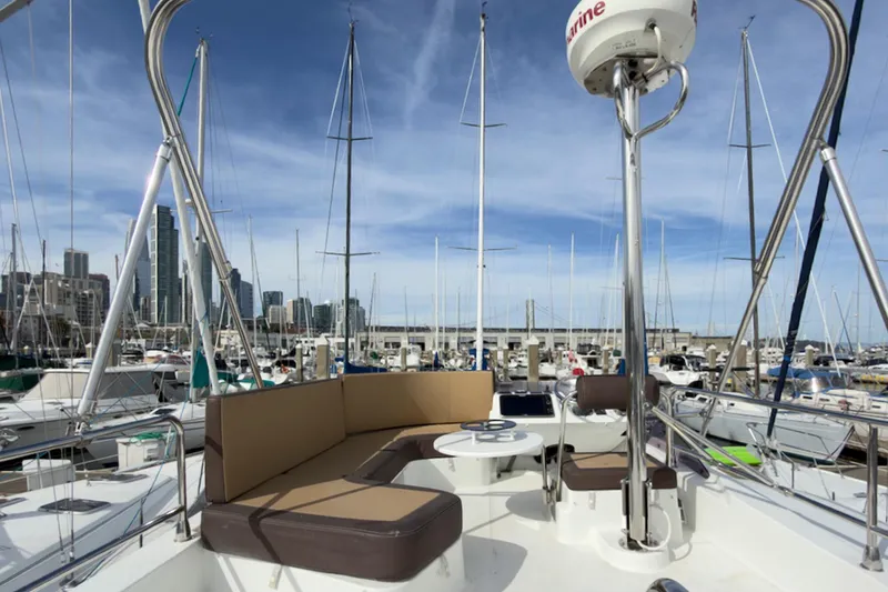 Slide: The Image of 2016 Beneteau Swift Trawler 30 at marina, city skyline in background. - 41