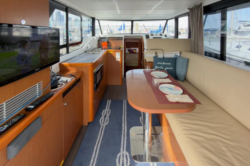 Slide: The Image of Interior of 2016 Beneteau Swift Trawler 30 with dining area and modern amenities. - 6