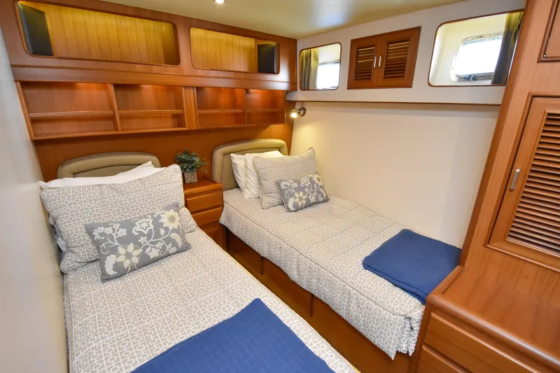 Slide: The Image of Luxurious twin cabin in 2013 Fleming 55 yacht with elegant wood finishes. - 11