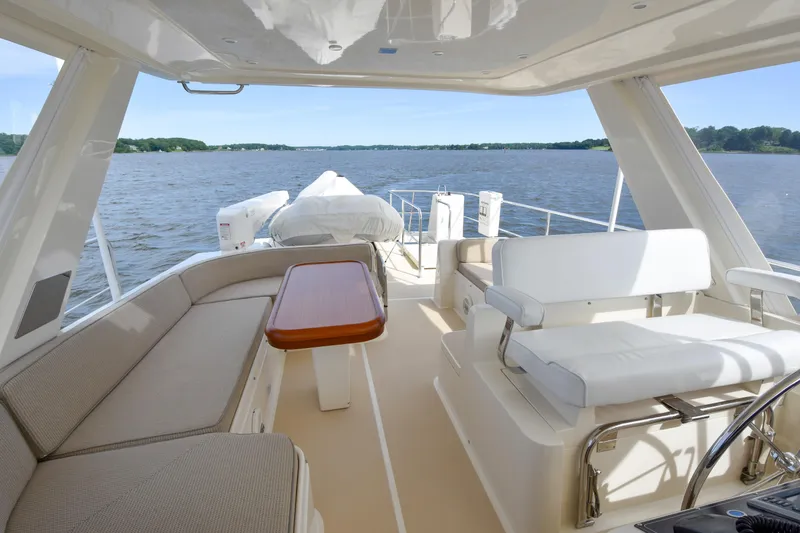 Slide: The Image of Luxurious 2013 Fleming 55 yacht interior with elegant seating and scenic water view. - 22