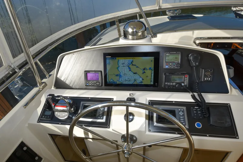 Slide: The Image of Helm of 2013 Fleming 55 yacht with navigation equipment and steering wheel. - 23
