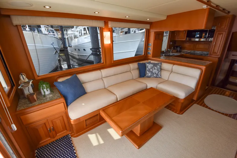 Slide: The Image of Luxurious interior of a 2013 Fleming 55 yacht with elegant seating and wooden finishes. - 4