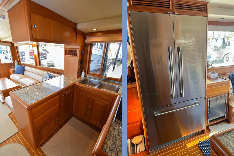 Slide: The Image of Luxurious interior of a 2013 Fleming 55 yacht featuring a modern kitchen and stainless steel appliances. - 7