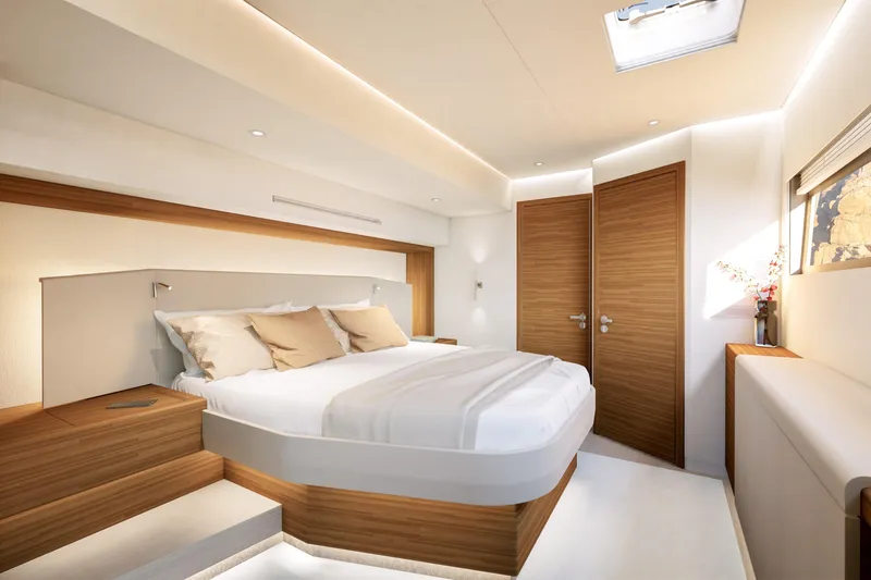 Slide: The Image of Luxurious bedroom interior of 2027 Fountaine Pajot FPY 70 yacht, featuring modern design and cozy ambiance. - 11