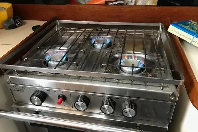 Slide: The Image of Stainless steel stove with four burners on a 1989 Freedom 38 Sloop yacht. - 13