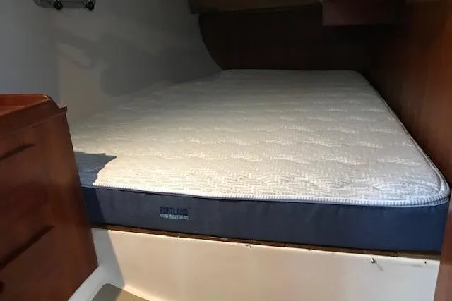 Slide: The Image of Interior cabin of 1989 Freedom 38 Sloop with a comfortable mattress. - 14