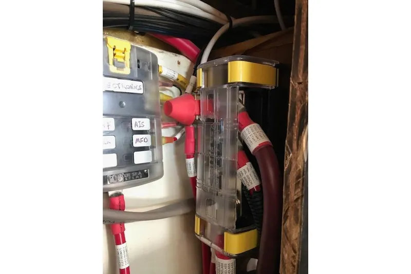 Slide: The Image of Electrical panel and wiring inside a 1989 Freedom 38 Sloop sailboat. - 24
