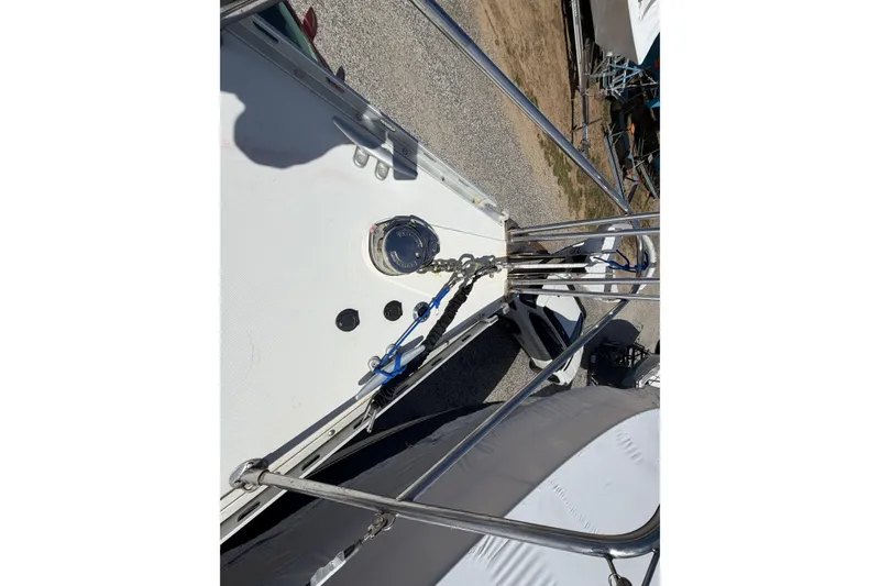Slide: The Image of 1989 Freedom 38 Sloop deck view with railing and winch details. - 50