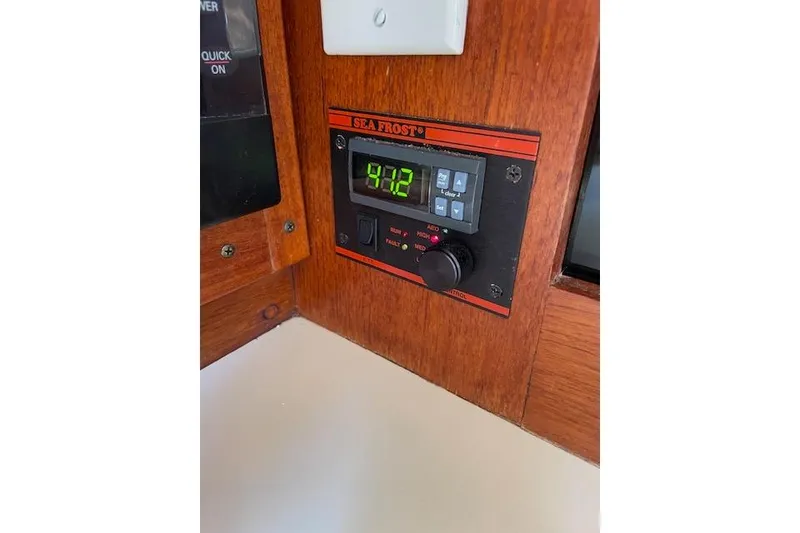 Slide: The Image of Digital control panel on 1989 Freedom 38 Sloop, displaying temperature settings. - 65