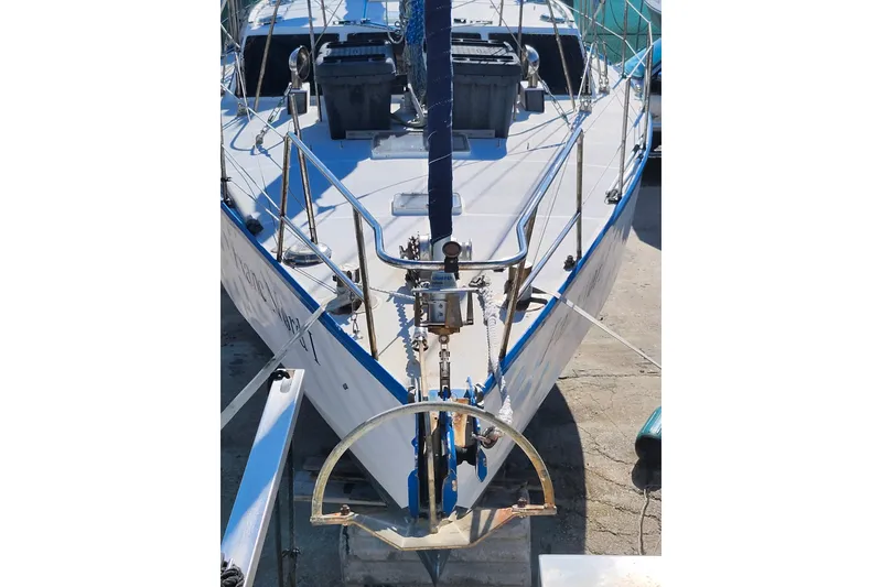 Slide: The Image of 1987 Custom Weld Exploration boat on dry dock, showcasing bow and deck details. - 35