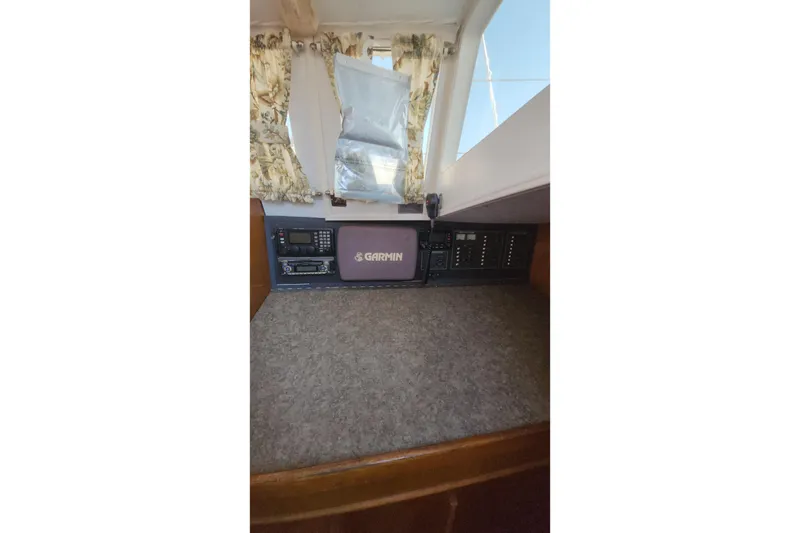 Slide: The Image of Control panel of a 1987 Custom Weld Exploration boat with Garmin navigation system. - 43