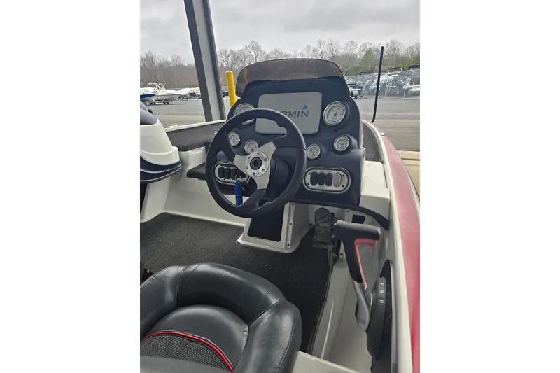 Slide: The Image of Interior view of a 2014 Nitro Z-7 boat with steering console. - 4