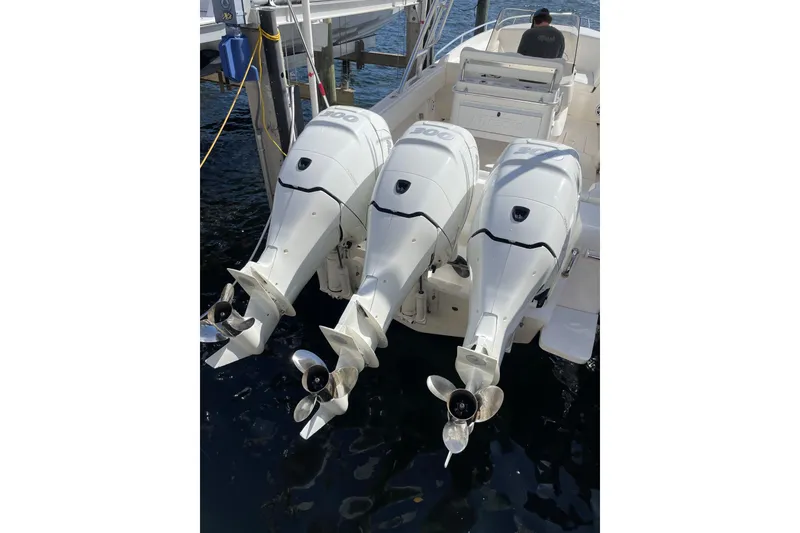 Slide: The Image of Triple outboard motors on a 2010 Intrepid 323 Cuddy boat. - 5