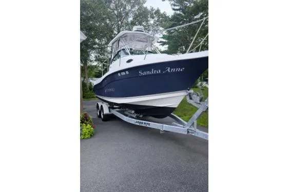 The Image of 2006 Seaswirl Striper 2601 Walkaround O/B boat on trailer, named "Sandra Anne." - 0
