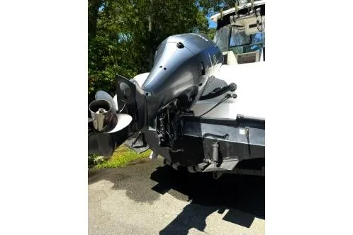 Slide: The Image of 2006 Seaswirl Striper 2601 Walkaround O/B boat engine and propeller detail. - 2