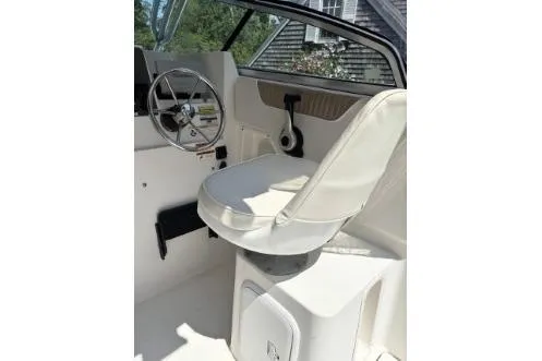 Slide: The Image of 2006 Seaswirl Striper 2601 Walkaround O/B boat interior with steering wheel and captain's seat. - 4