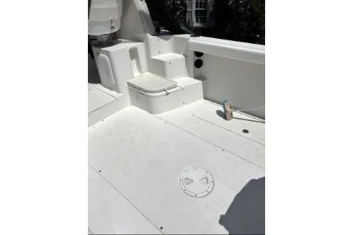 Slide: The Image of 2006 Seaswirl Striper 2601 Walkaround O/B boat deck, featuring seating and storage. - 7