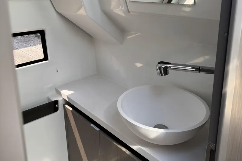 Slide: The Image of 2024 Jeanneau NC 895 Series 2 bathroom with modern sink and sleek faucet design. - 13