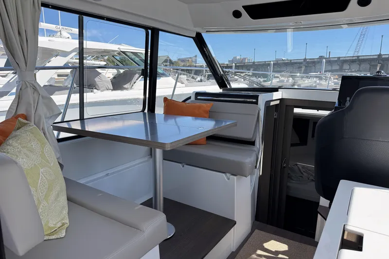 Slide: The Image of Interior of 2024 Jeanneau NC 895 Series 2 boat with seating and table. - 3