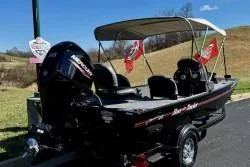 Slide: The Image of 2025 Tracker Bass Tracker Classic XL boat with canopy on a sunny day. - 12