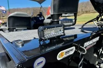 Slide: The Image of 2025 Tracker Bass Tracker Classic XL boat with LED light and stickers on deck. - 13
