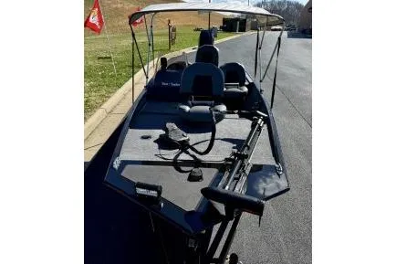 Slide: The Image of 2025 Tracker Bass Tracker Classic XL fishing boat with canopy on a sunny day. - 3