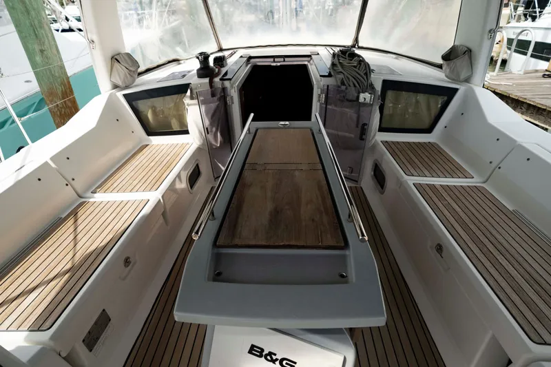 Slide: The Image of 2017 Beneteau Oceanis 41.1 yacht cockpit with teak seating and modern design. - 11
