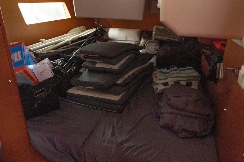 Slide: The Image of Interior cabin of a 2017 Beneteau Oceanis 41.1 yacht with cushions and supplies. - 33