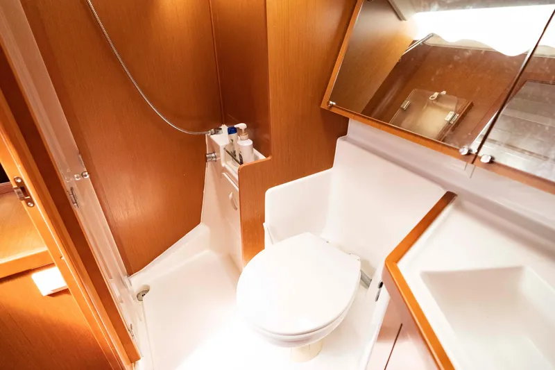 Slide: The Image of Bathroom interior of 2017 Beneteau Oceanis 41.1 yacht, featuring wooden cabinetry and modern fixtures. - 36