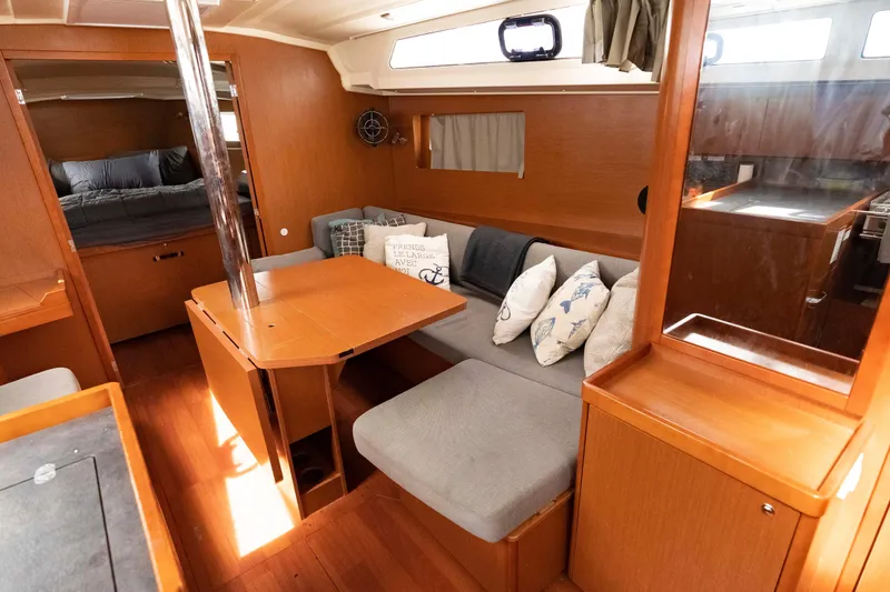 Slide: The Image of 2017 Beneteau Oceanis 41.1 interior with cozy seating, wooden finishes, and natural light. - 38
