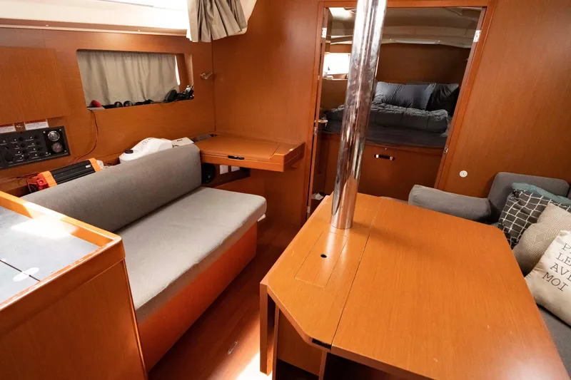 Slide: The Image of Interior of 2017 Beneteau Oceanis 41.1 yacht with cozy seating and wooden furnishings. - 39