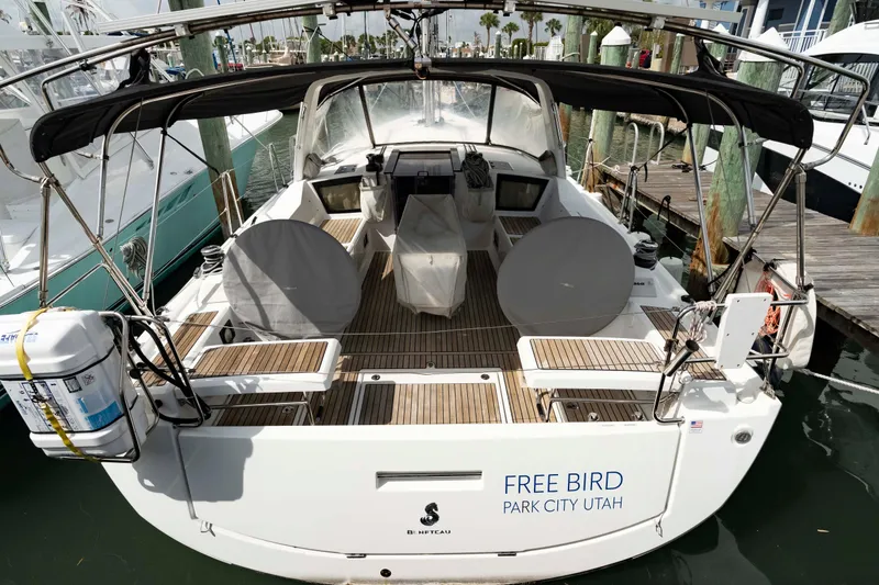 Slide: The Image of 2017 Beneteau Oceanis 41.1 sailboat docked, featuring spacious cockpit and covered helm. - 4