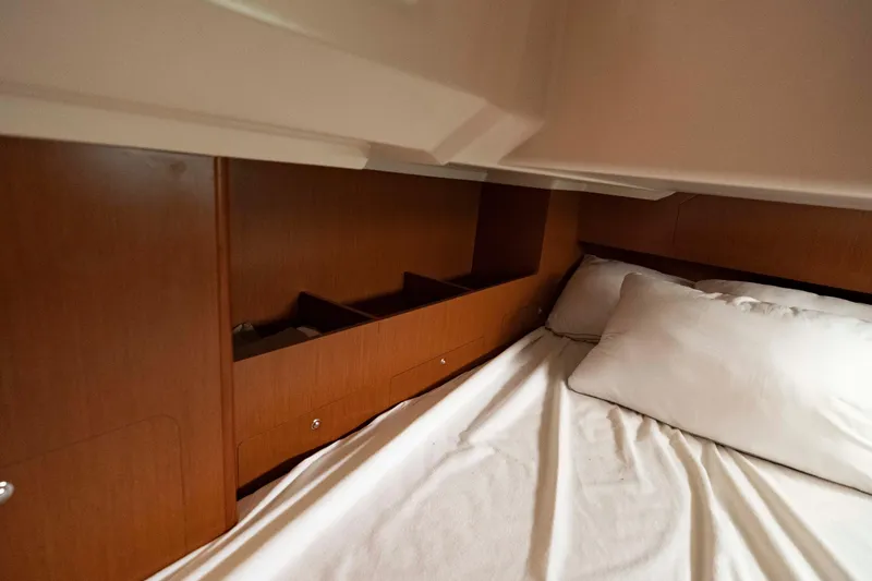 Slide: The Image of Interior cabin of 2017 Beneteau Oceanis 41.1 yacht with wooden storage and bed. - 45