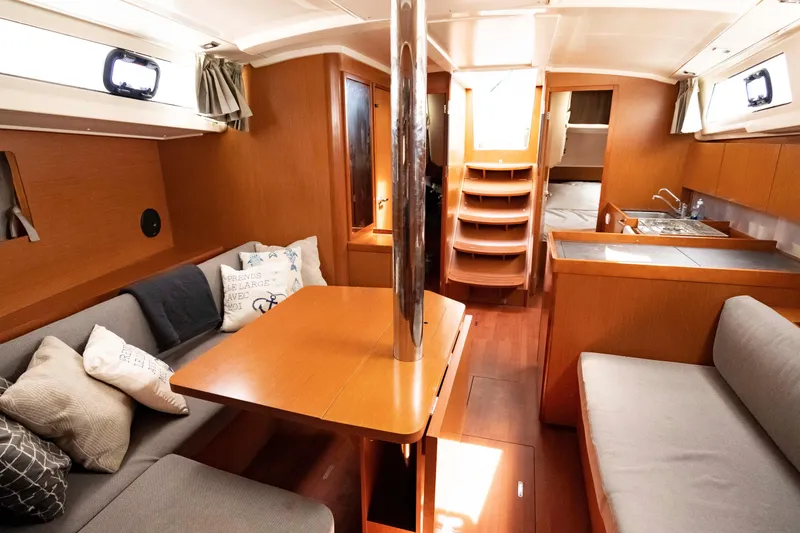 Slide: The Image of Interior of 2017 Beneteau Oceanis 41.1 yacht with cozy seating and modern kitchen. - 46