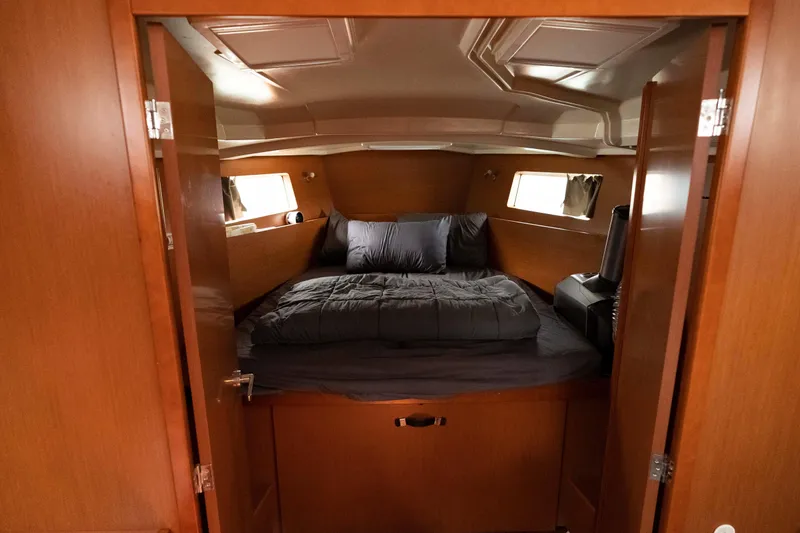 Slide: The Image of Cozy cabin interior of 2017 Beneteau Oceanis 41.1 yacht with wooden finish and comfortable bedding. - 48