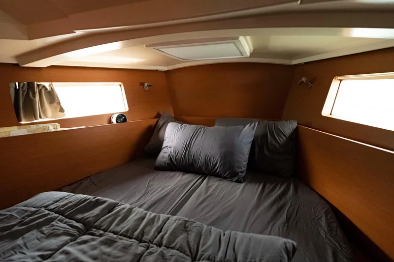 Slide: The Image of Cozy cabin interior of 2017 Beneteau Oceanis 41.1 sailboat with comfortable bedding. - 49