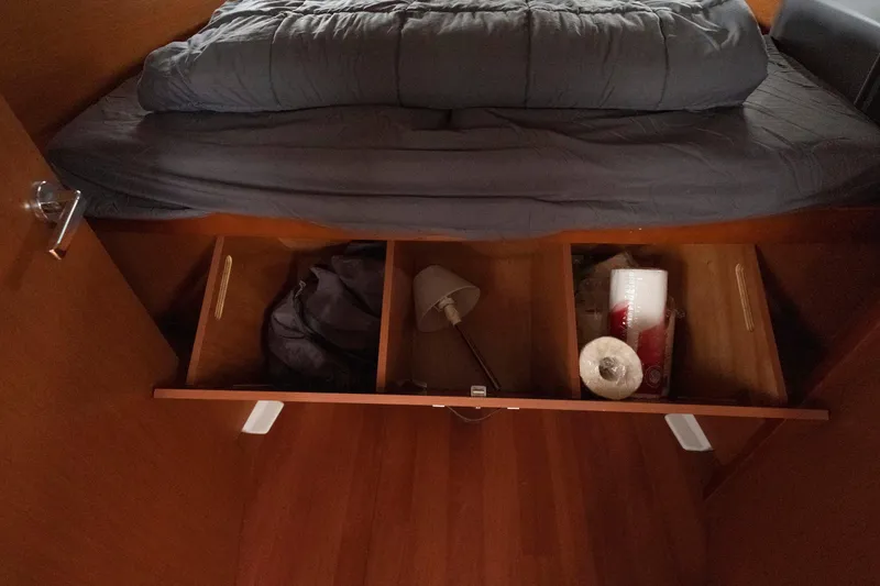 Slide: The Image of Under-bed storage on 2017 Beneteau Oceanis 41.1 yacht with various items organized neatly. - 52