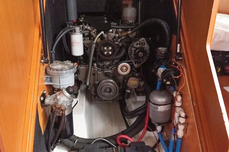Slide: The Image of Engine compartment of a 2017 Beneteau Oceanis 41.1 sailboat, showcasing mechanical components. - 55