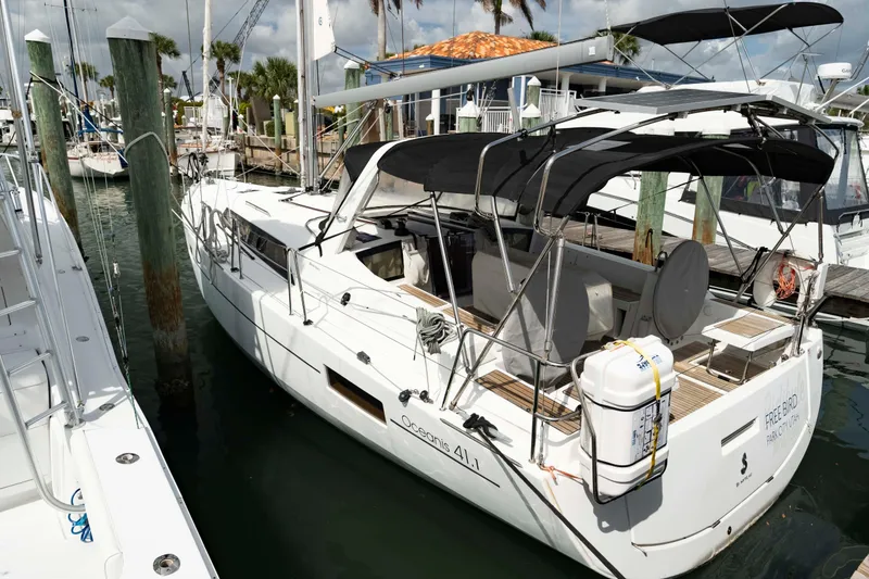 Slide: The Image of 2017 Beneteau Oceanis 41.1 yacht docked at marina, featuring sleek design and spacious deck. - 6