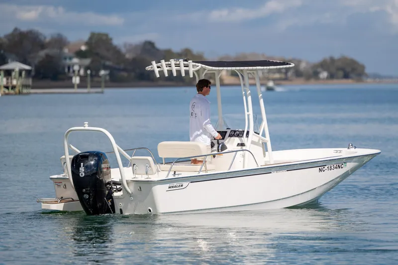 Slide: The Image of 2022 Boston Whaler 190 Montauk boat cruising on calm waters. - 2