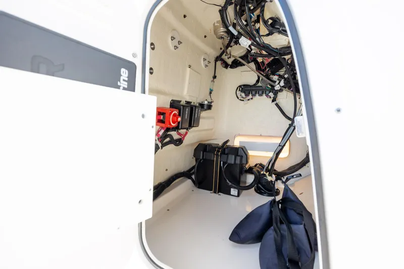 Slide: The Image of 2022 Boston Whaler 190 Montauk interior wiring and battery compartment view. - 22