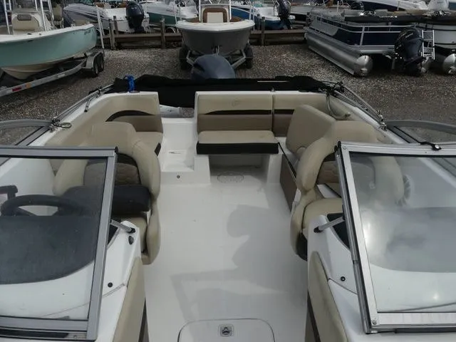 Slide: The Image of 2019 Hurricane SunDeck 217 OB boat with open cabin and seating. - 13