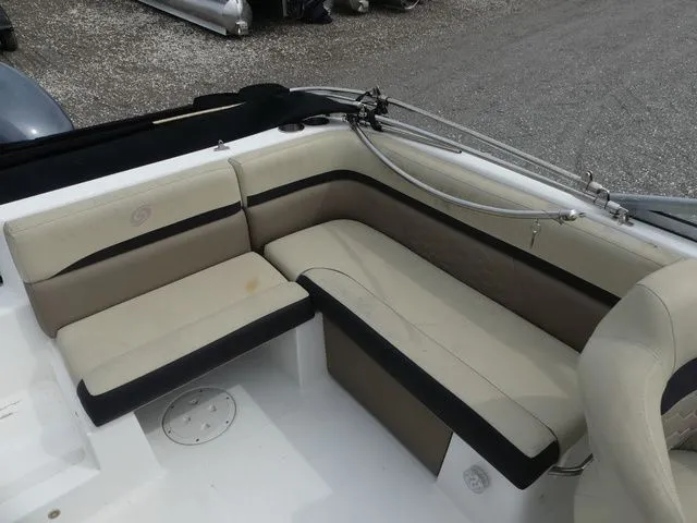 Slide: The Image of Interior of a 2019 Hurricane SunDeck 217 OB boat with beige seating. - 14