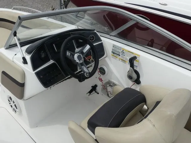 Slide: The Image of Interior view of 2019 Hurricane SunDeck 217 OB boat cockpit. - 16