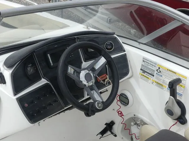 Slide: The Image of Cockpit of a 2019 Hurricane SunDeck 217 OB boat. - 17