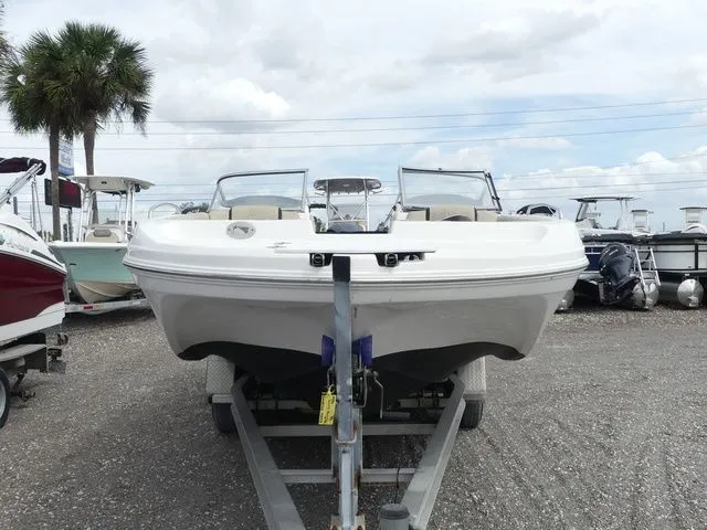 Slide: The Image of 2019 Hurricane SunDeck 217 OB boat on trailer, front view. - 2